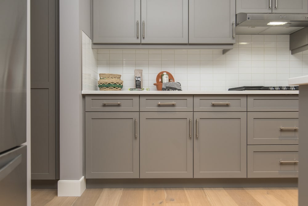 beautiful-shot-modern-house-kitchen-shelves-drawers-min